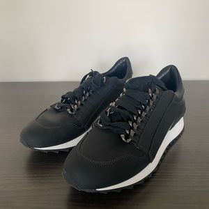 Casadei "Running Donna" Black Sneakers with Chain Design.